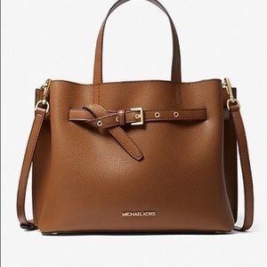 Michael Kors leather satchel with gold tone and shoulder strap.